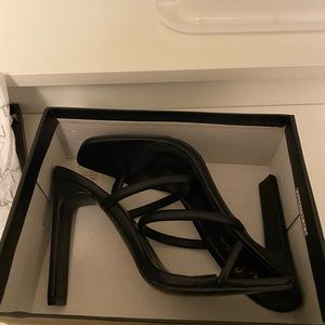 Black heels. Never worn